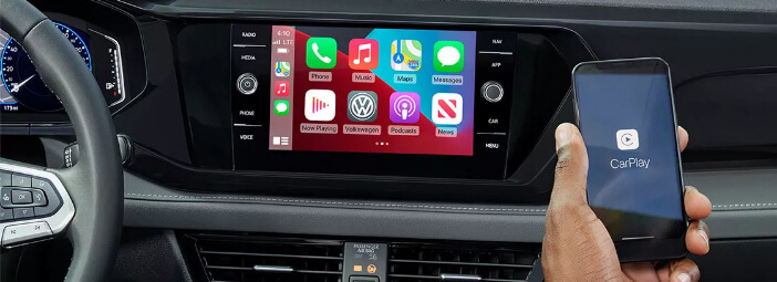 Person connecting phone to 2023 Volkswagen Atlas infotainment center