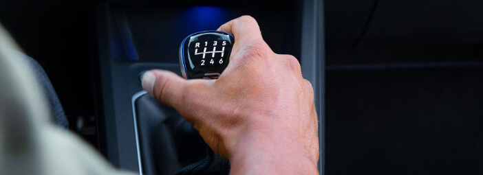 Person holding manual transmission Gear shift in 2023 volkswagen Golf R