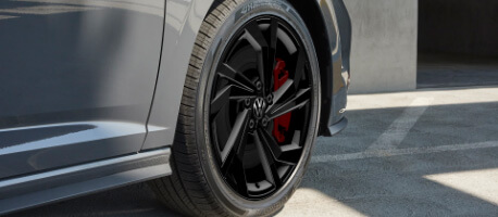 2023 Volkswagen Jetta GLI front passenger side tire with black aluminium rim