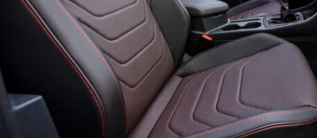 Maroon and black leather front seat in 2023 Volkswagen Jetta GLI