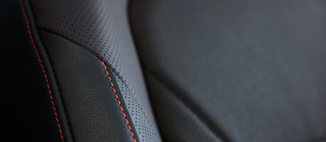 Red stitching on black leather seat arm in 2023 Volkswagen Jetta GLI