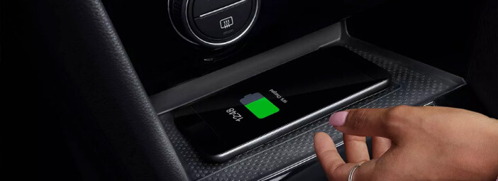 Phone charging on wireless charging pad in center console of 2023 Volkswagen Taos