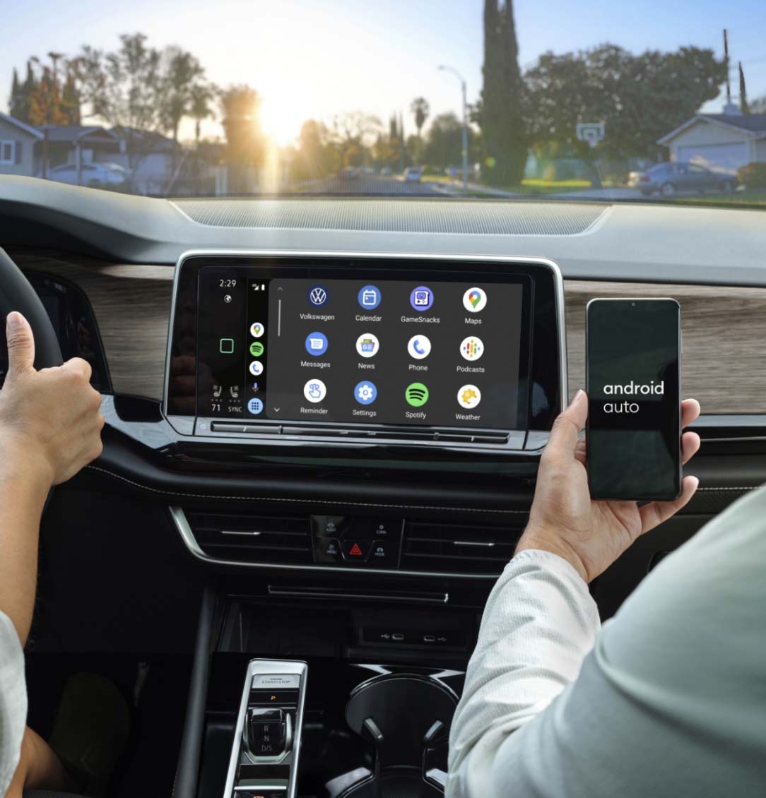 Person connecting their myVW app to their vehicles control panel