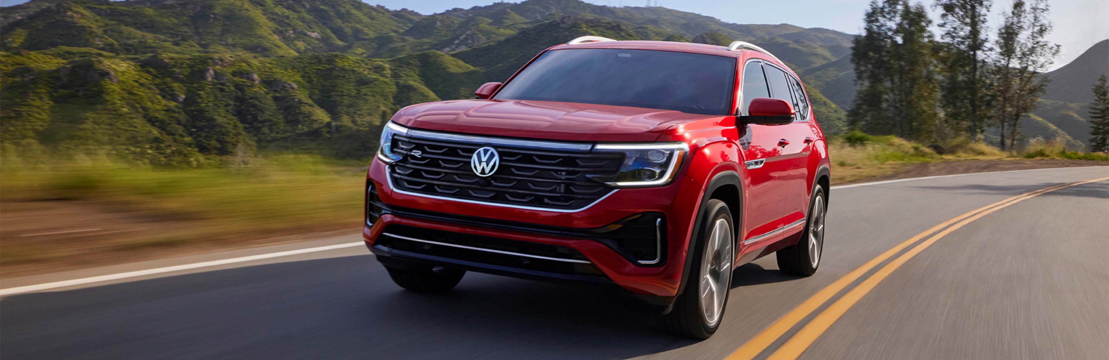 2025 Volkswagen Atlas driving down the road