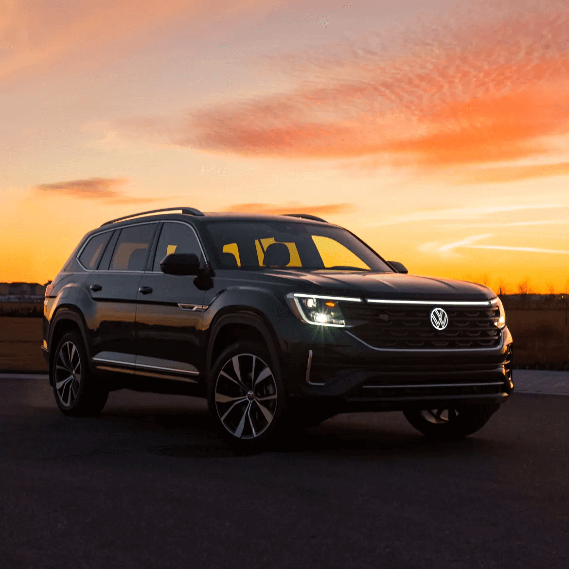 2025 Volkswagen Atlas parked on the road with high beams on