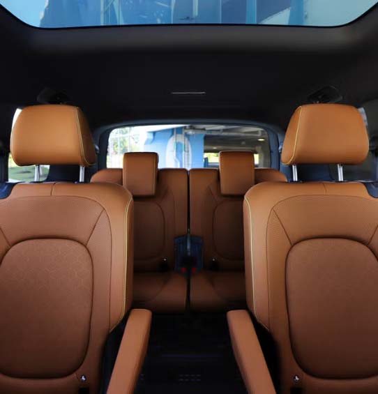 The rear seats of a 2025 ID. Buzz in a brown leather interior.