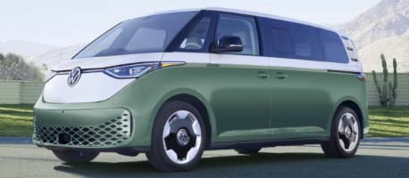 Green vw buzz driving near grass field