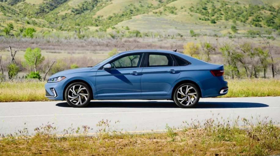 Side View of Blue Jetta parked on road