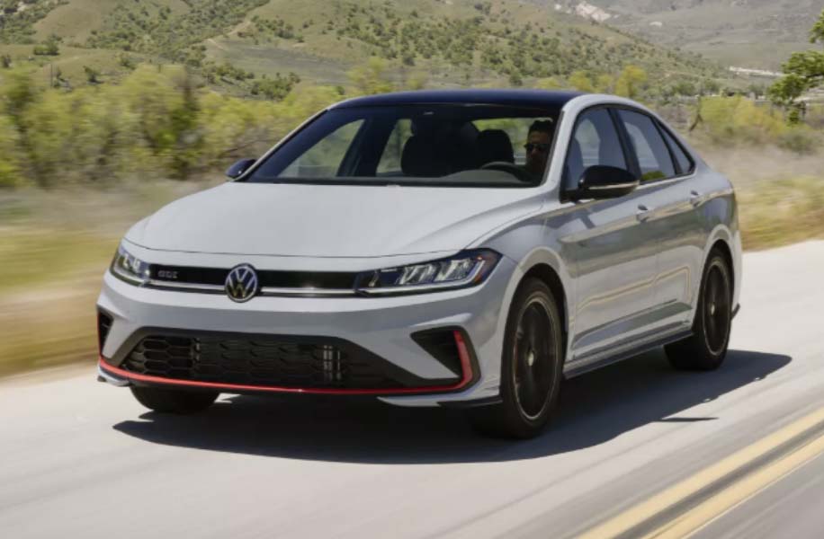 2025 Jetta GLI driving down the road