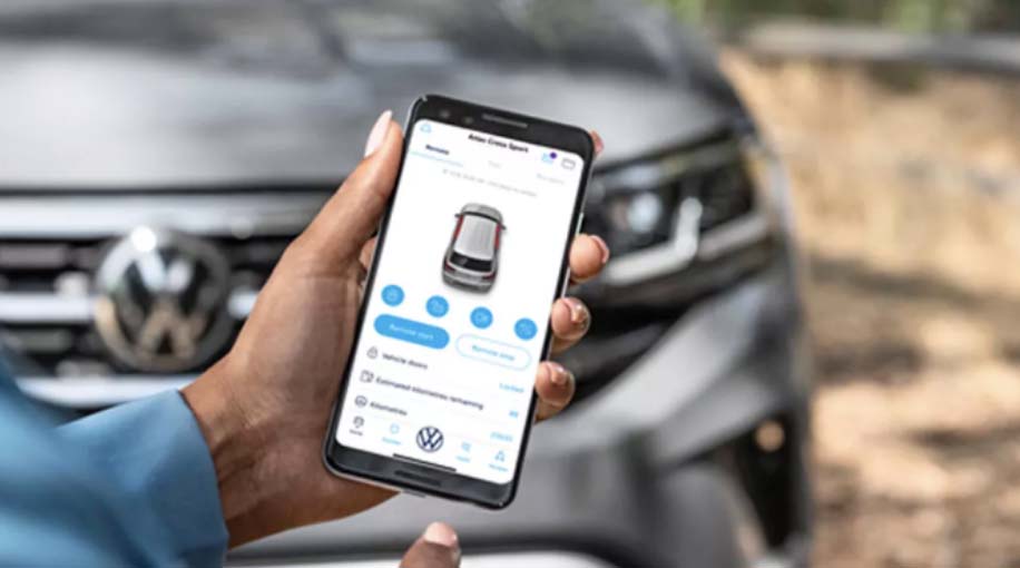 Person holding phone with MyVW App
