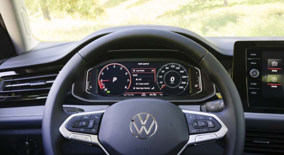 Close-up of the 2026 Volkswagen Jetta Digital Cockpit Pro displaying driving assist options.