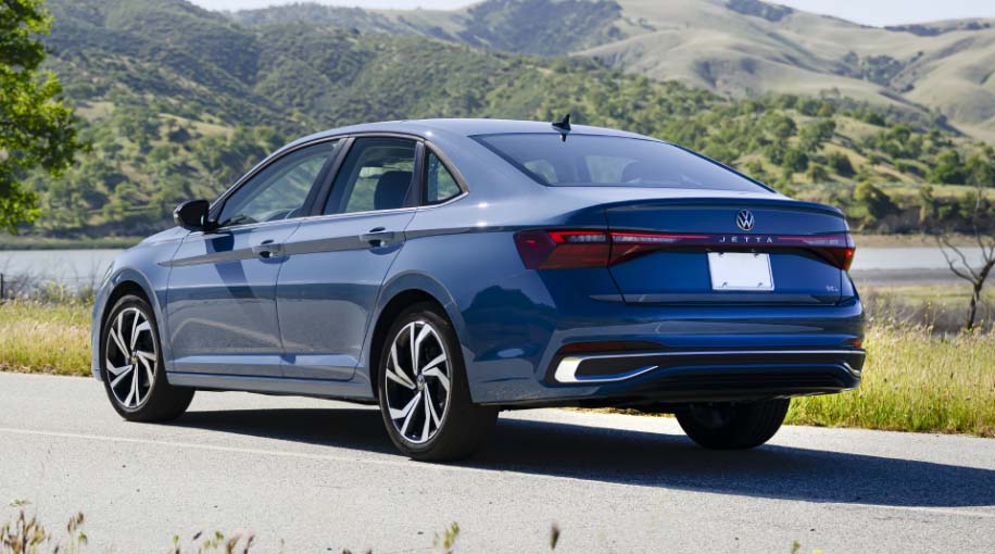 Rear interior of the 2026 Jetta featuring leather seats with visible stitching and ample legroom.