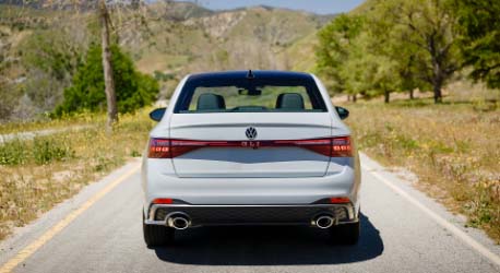 Rear_view_white_vw_jetta_gli_parked_on_grass
