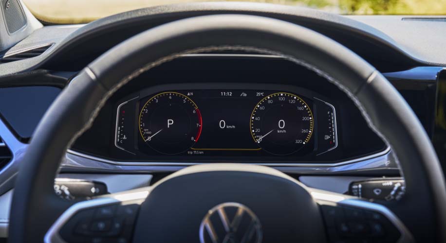 Close-up of the 2026 Volkswagen Taos digital cockpit displaying speedometer and driving data.