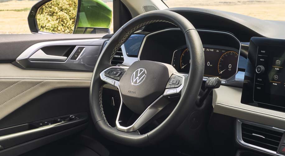 Close-up of the standard heated leatherette steering wheel in the 2026 Volkswagen Taos.