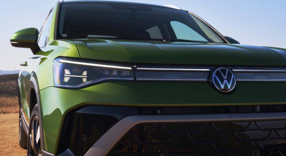 Front detail view of the 2026 Volkswagen Taos in green, highlighting one of the available colour options.