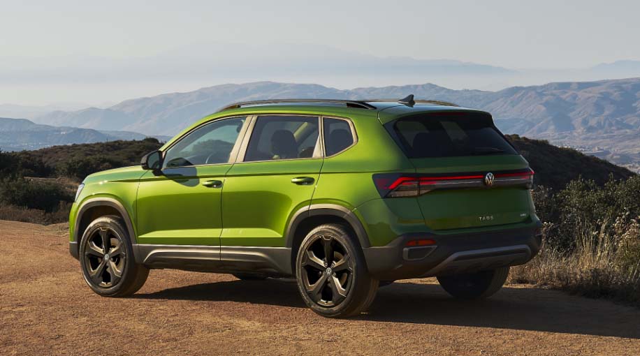 A 2026 Taos parked on a dirt road overlooking a mountain range