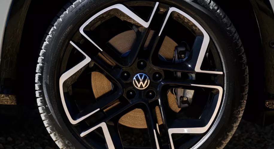 Detail shot of the black and silver alloy wheel on a 2025 volkswagen tiguan
