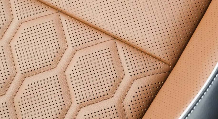 The sleek design of the 2025 volkswagen tiguan%27s front end showcasing its headlights and illuminated logo