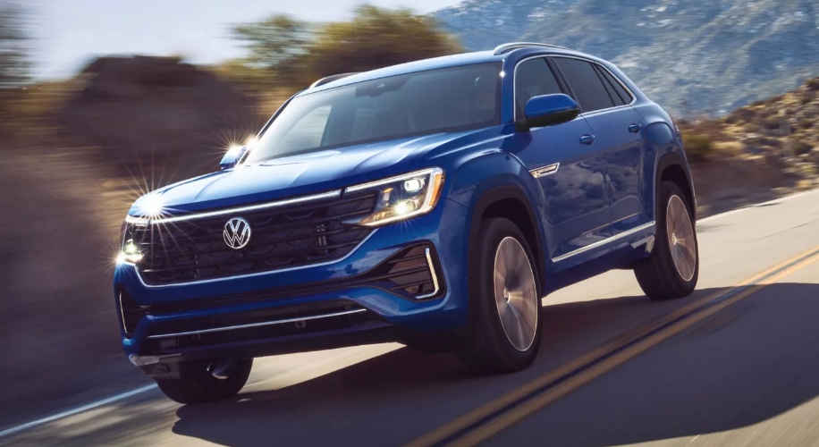Blue 2026 VW Atlas Cross Sport driving on the road