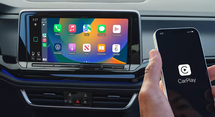 Person holding phone with CarPlay app