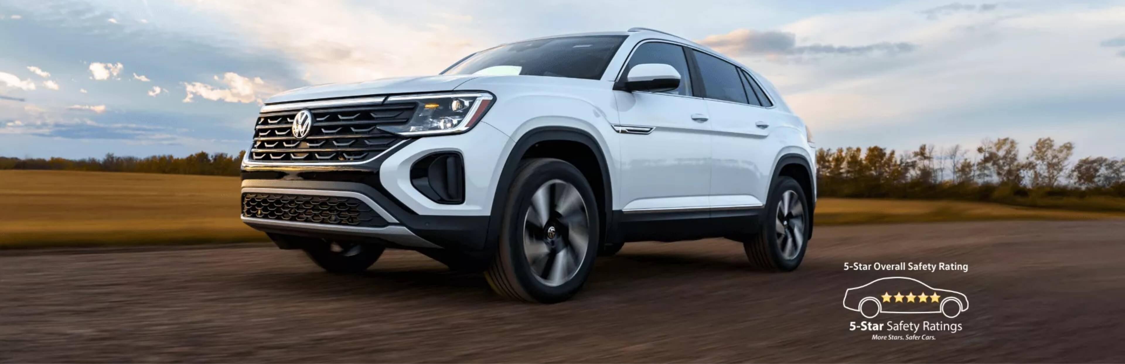 2026 Atlas Cross Sport driving on a dirt road