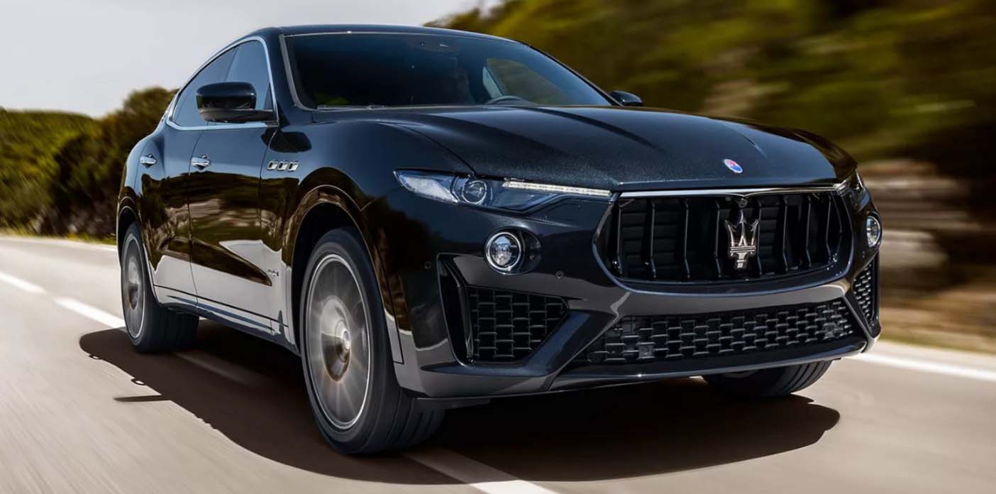 Black Maserati Levante driving on the road