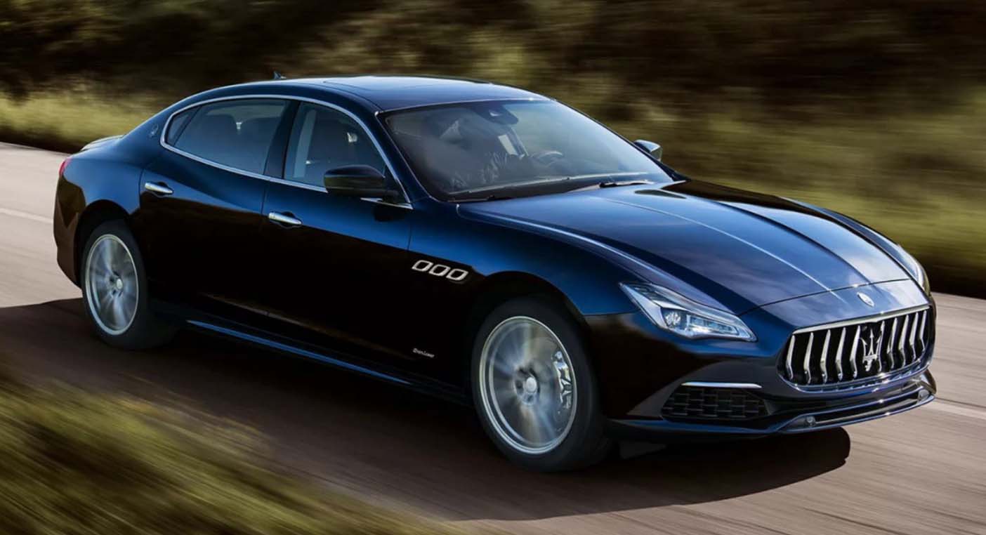 Black Maserati Quattroporte side view in motion