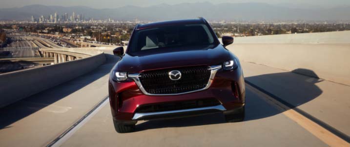 Mazda driving down the road