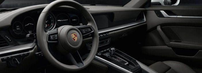 close up view of porsche 911 front cabin and infotainment system